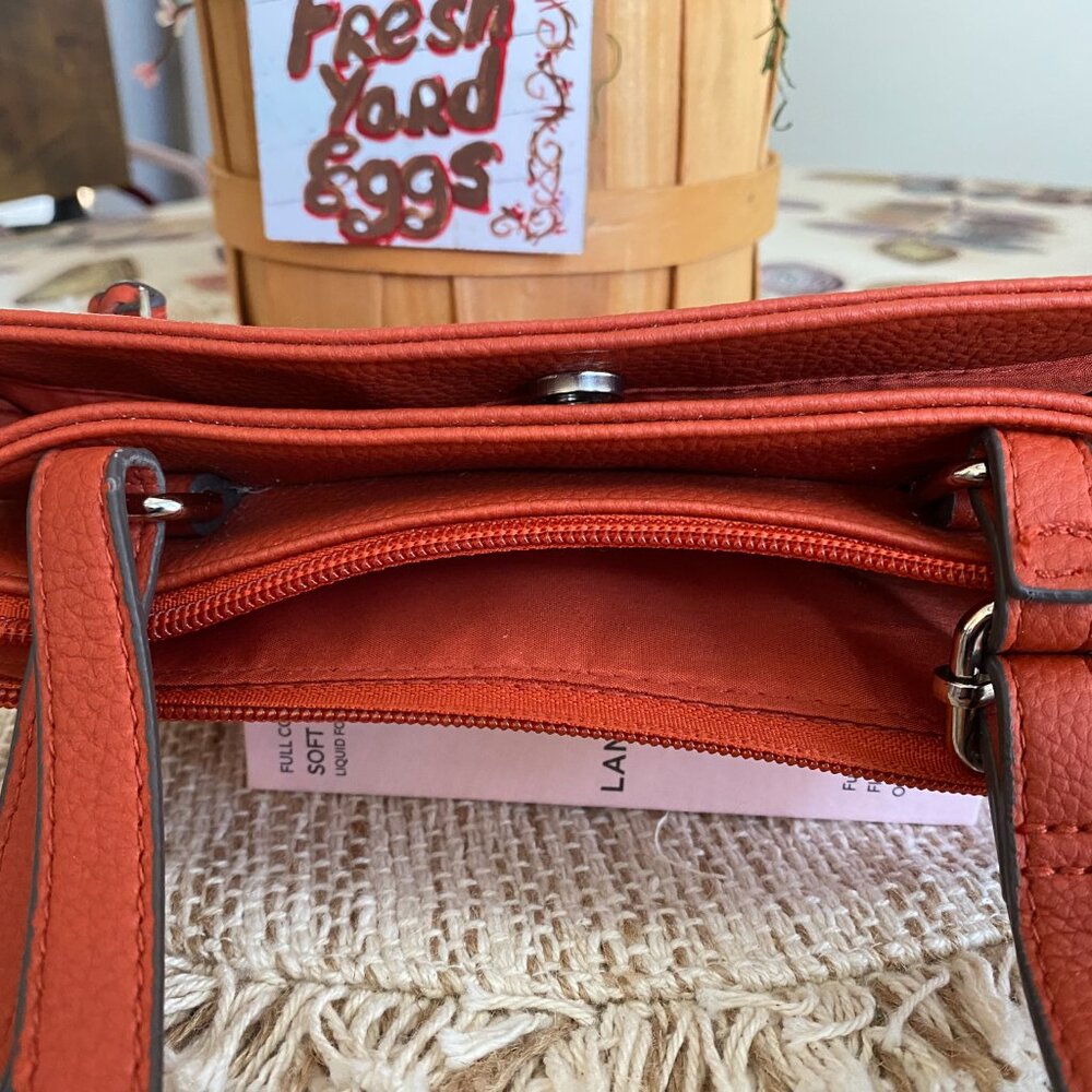 Gently used one time. Rust color both zipper top and snap closed bag w/strap - Picture 4 of 4